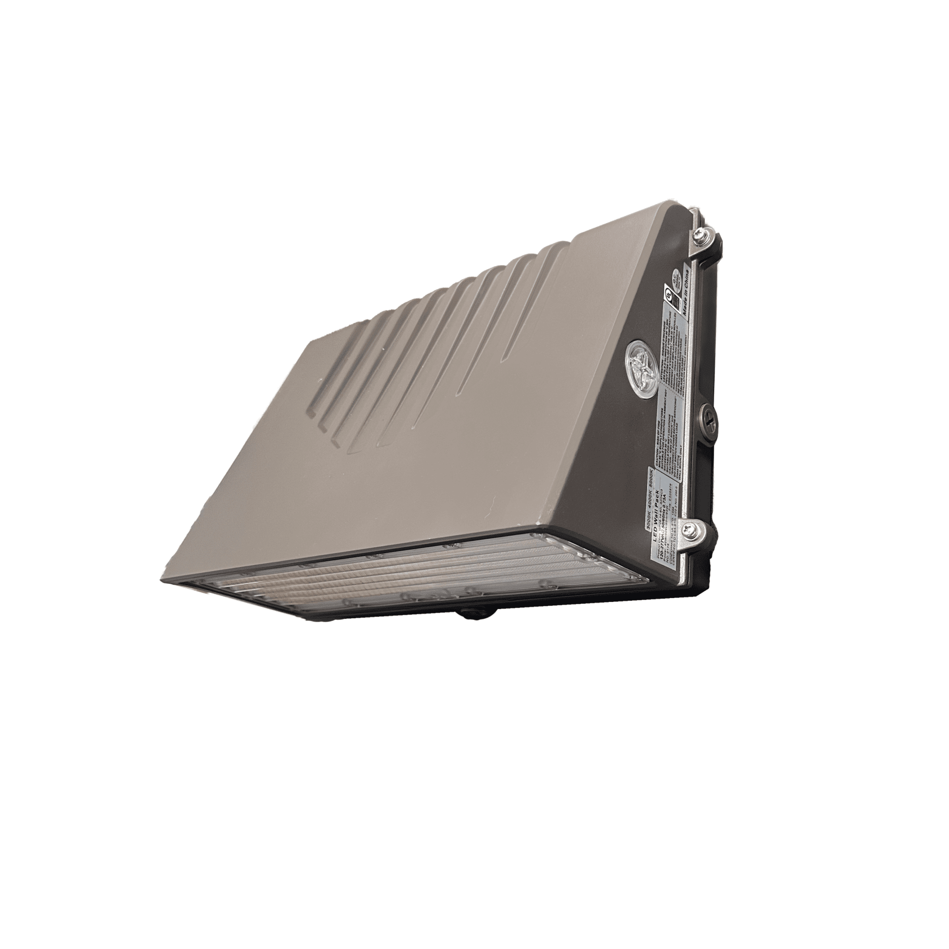 Front veiw Full Cuttoff wall pack The Full Cutoff Wall Pack With Emergency Battery Backup-WP28 series features a rectangular, gray LED design with a ribbed top surface, side mounting screws, and a transparent bottom revealing internal components. It is angled on a white background.
